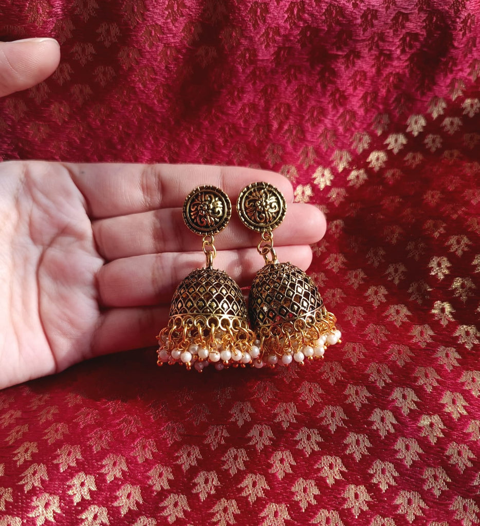 Oxidised gold jhumka with white beads