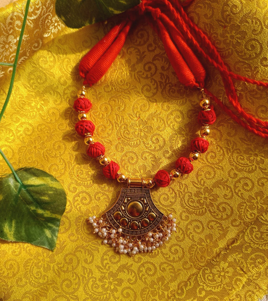 Red and Gold bead necklace with pendant