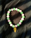 Pink and Green glass beaded bracelet with leaf cham