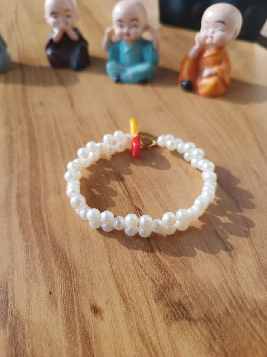 White Bead Bracelet with Cowrie